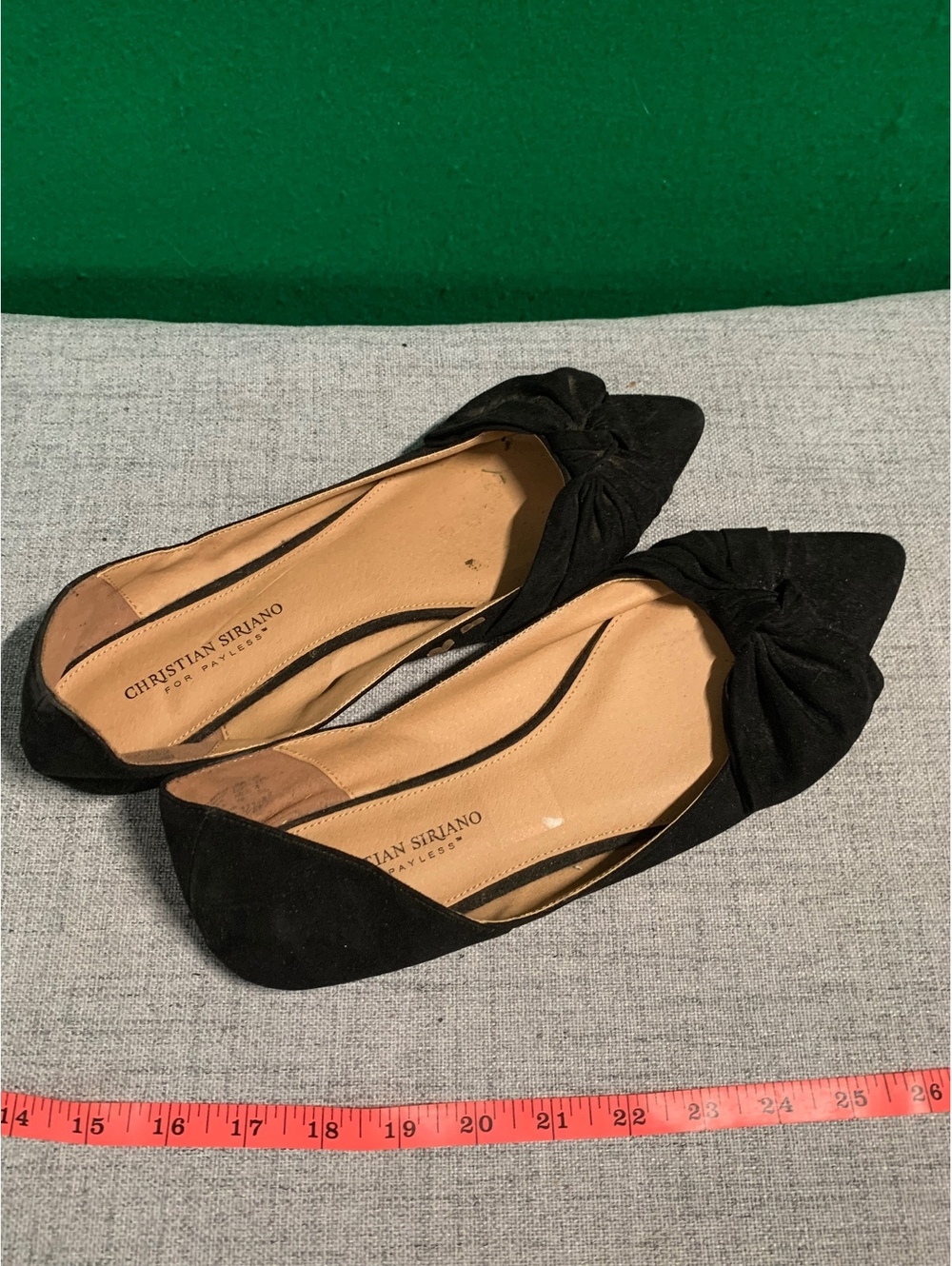 Black pointed toe flats with bow detail